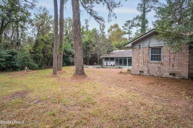 view of yard with a sunroom