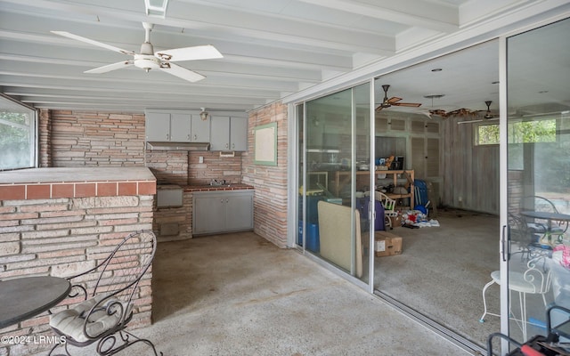 view of patio / terrace featuring ceiling fan and sink