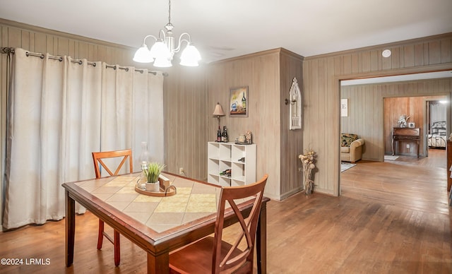 dining area featuring an inviting chandelier and wood-type flooring