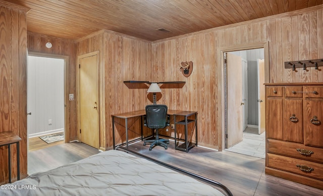 bedroom featuring wood ceiling, wood-type flooring, and wood walls