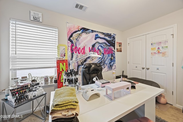 carpeted office featuring visible vents