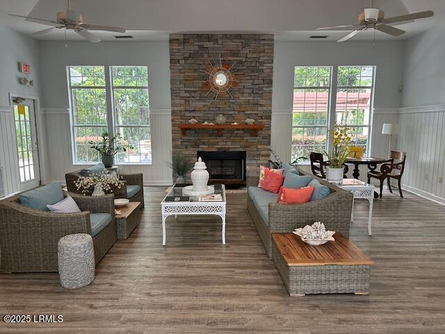 100 Kensington Blvd Unit 1315, Bluffton, SC 29910 - living room with a ceiling fan, a decorative wall, wood finished floors, wainscoting, and a fireplace