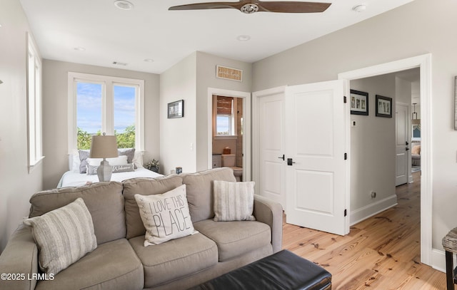 18 Sand Dollar Ct, Harbor Island, SC 29920 - bedroom with ceiling fan, ensuite bathroom, and light wood-type flooring