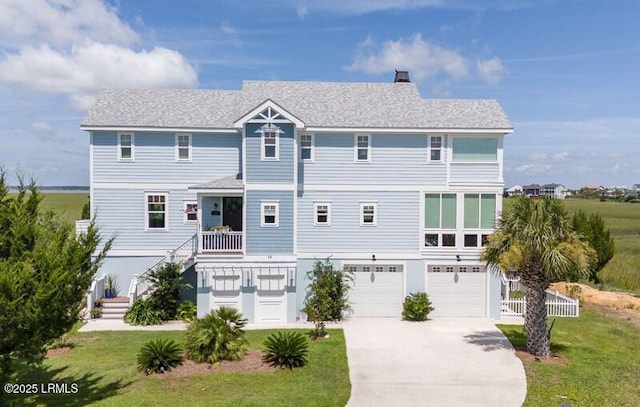 18 Sand Dollar Ct, Harbor Island, SC 29920 - back of house with a garage and a lawn