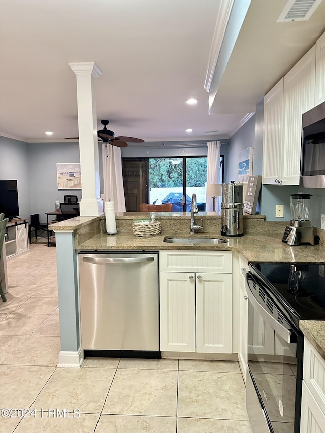 kitchen featuring appliances with stainless steel finishes, sink, ornamental molding, light stone counters, and kitchen peninsula