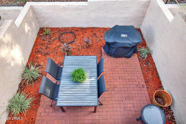 view of patio with a grill