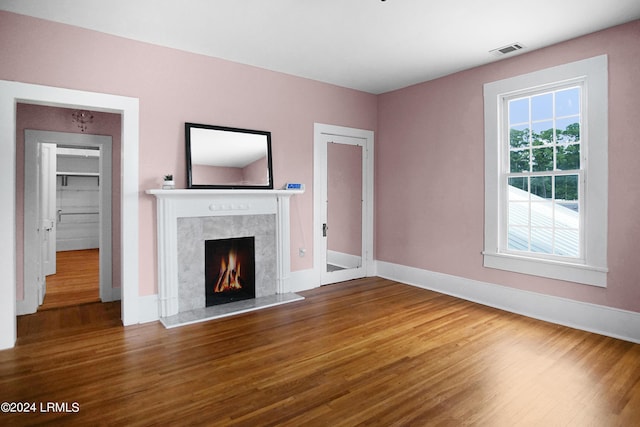 unfurnished living room with wood-type flooring