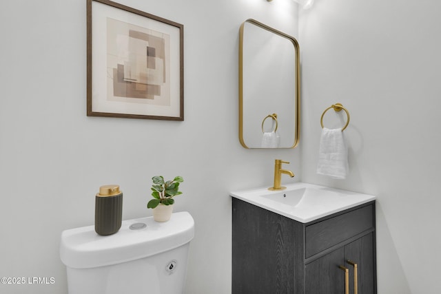 bathroom with toilet and vanity