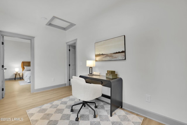 office featuring light wood-style floors and baseboards