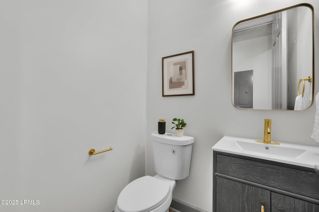 half bath with vanity and toilet