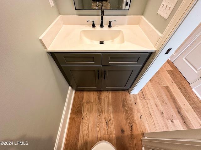 bathroom featuring vanity and hardwood / wood-style floors