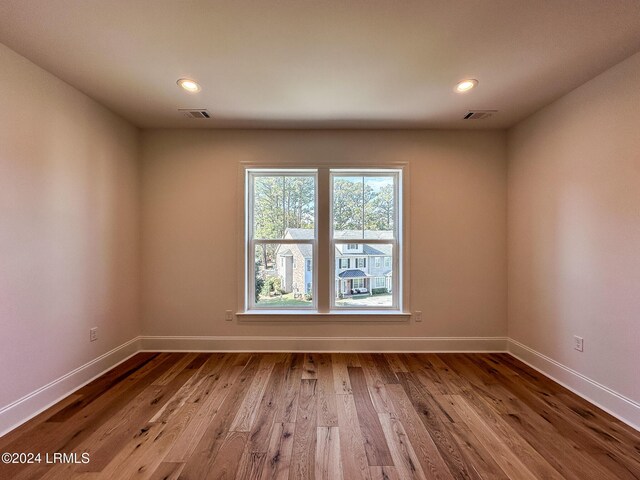 spare room with hardwood / wood-style flooring