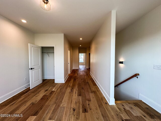 corridor featuring dark hardwood / wood-style floors