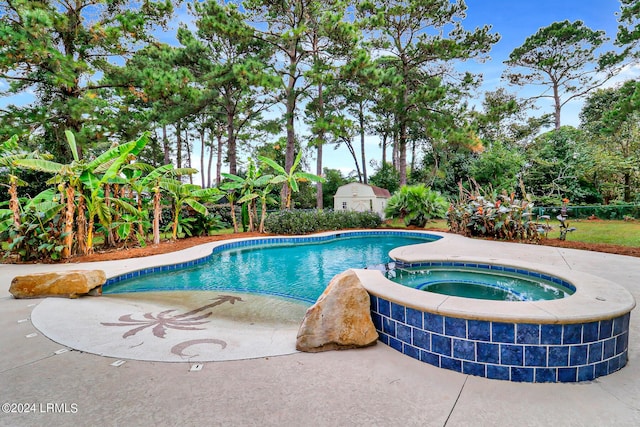 view of swimming pool featuring an in ground hot tub