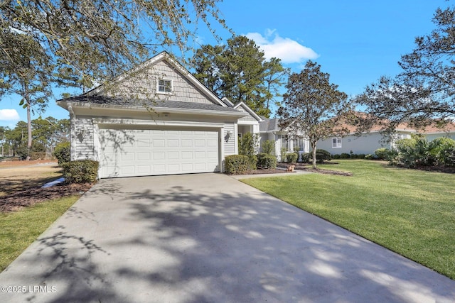 view of front of property featuring a garage and a front yard