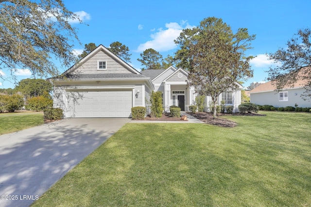 view of front of home with a garage and a front yard