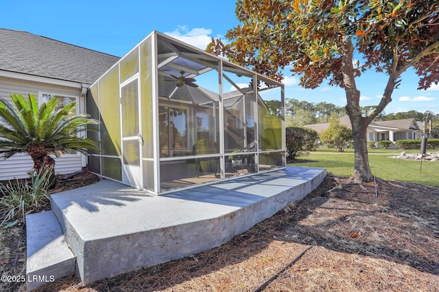 rear view of house featuring a patio and a yard