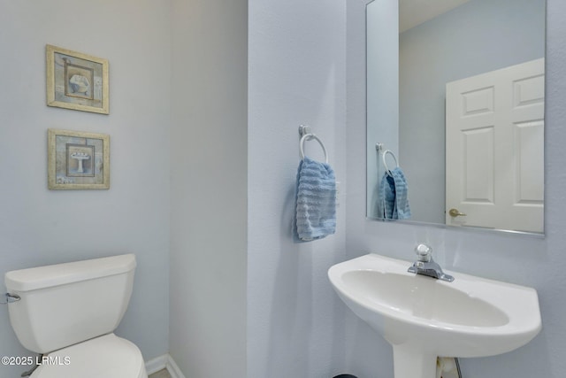 bathroom featuring sink and toilet