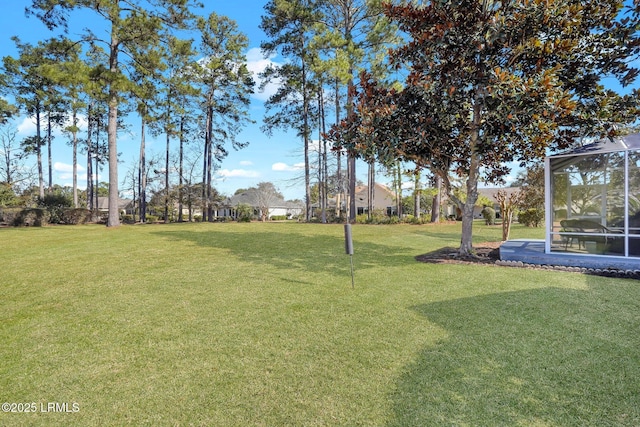 view of yard featuring a lanai