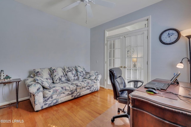 office space with light hardwood / wood-style floors and ceiling fan