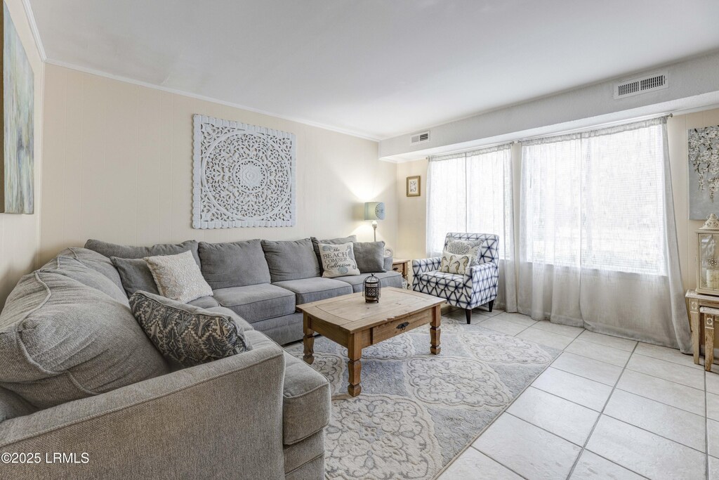 100 Mathews Dr Unit A15, Hilton Head Island, SC 29926 - living area with ornamental molding and light tile patterned floors