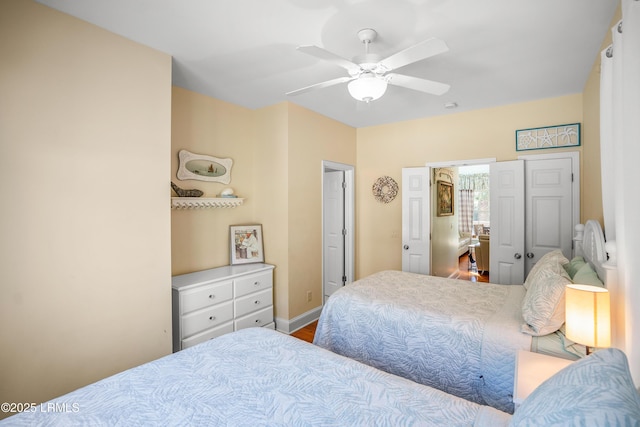 bedroom with baseboards and a ceiling fan