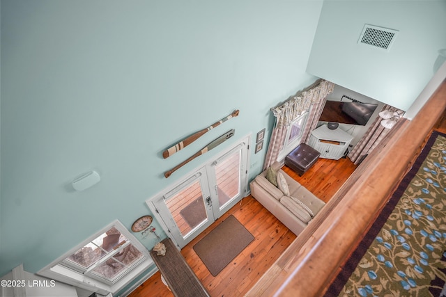 interior space featuring visible vents and wood finished floors