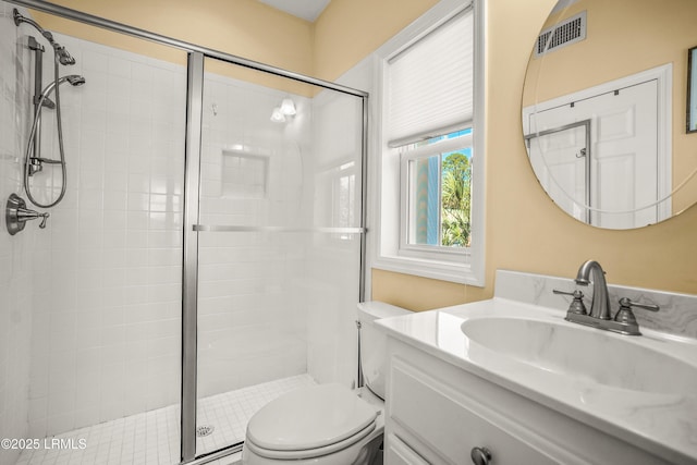 full bath featuring visible vents, a stall shower, toilet, and vanity