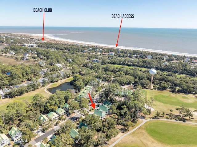 birds eye view of property featuring golf course view and a water view