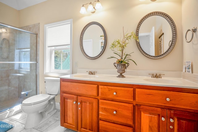 full bath featuring a shower stall, toilet, and a sink