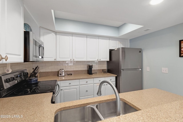 6 Lighthouse Ln Unit 963, Hilton Head Island, SC 29928 - kitchen featuring appliances with stainless steel finishes, tasteful backsplash, light countertops, and white cabinets