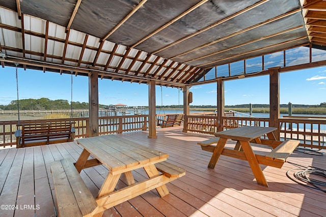 dock area featuring a deck with water view