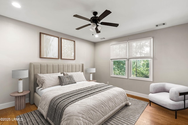 bedroom with hardwood / wood-style flooring and ceiling fan