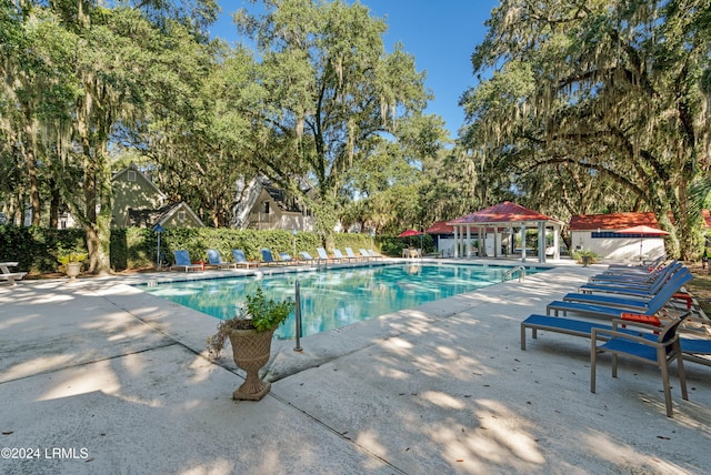 view of swimming pool featuring a gazebo and a patio area