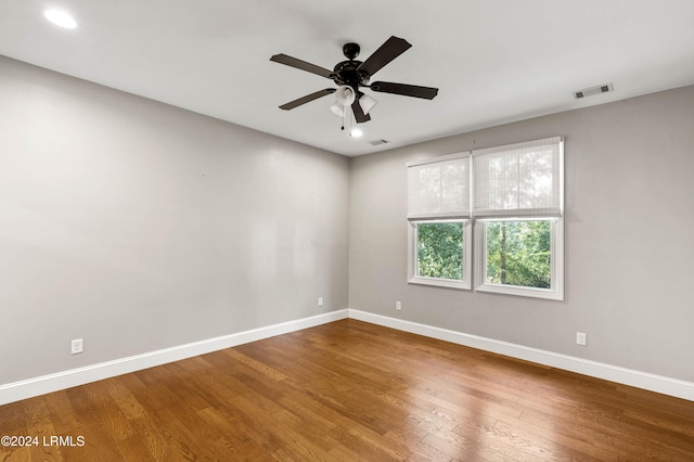 unfurnished room with ceiling fan and hardwood / wood-style floors