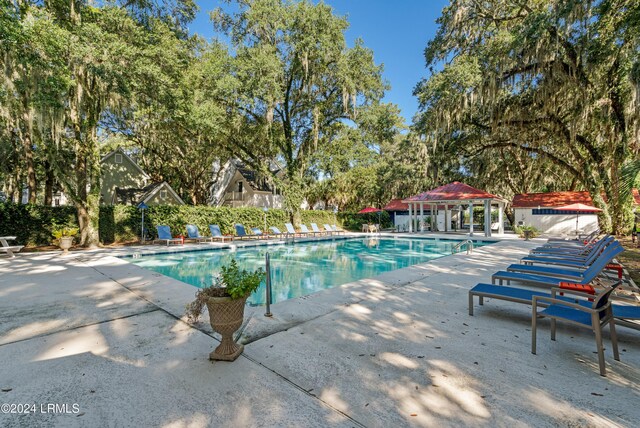 view of pool with a gazebo and a patio