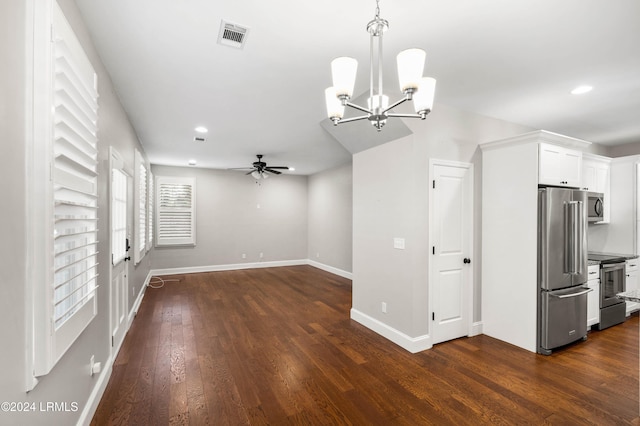 kitchen featuring appliances with stainless steel finishes, dark hardwood / wood-style floors, ceiling fan with notable chandelier, and white cabinets