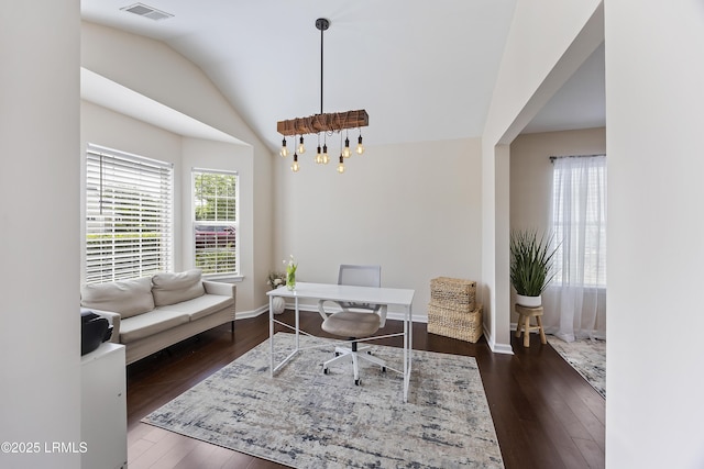 office space with hardwood / wood-style floors, visible vents, baseboards, and vaulted ceiling