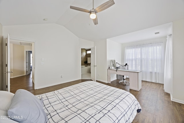 bedroom with dark wood-style floors, visible vents, lofted ceiling, and baseboards