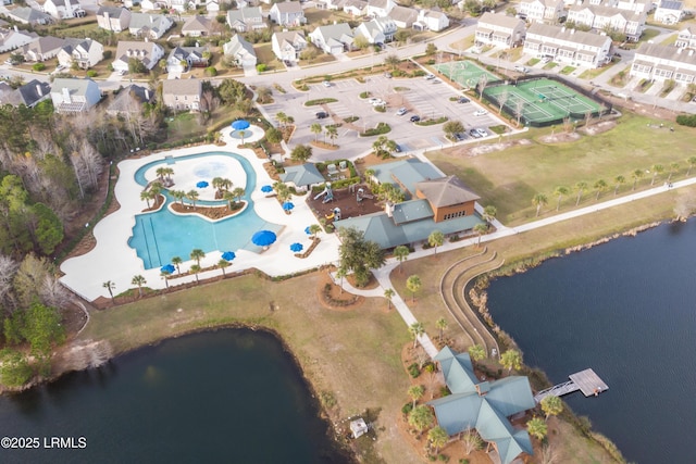 birds eye view of property with a residential view and a water view