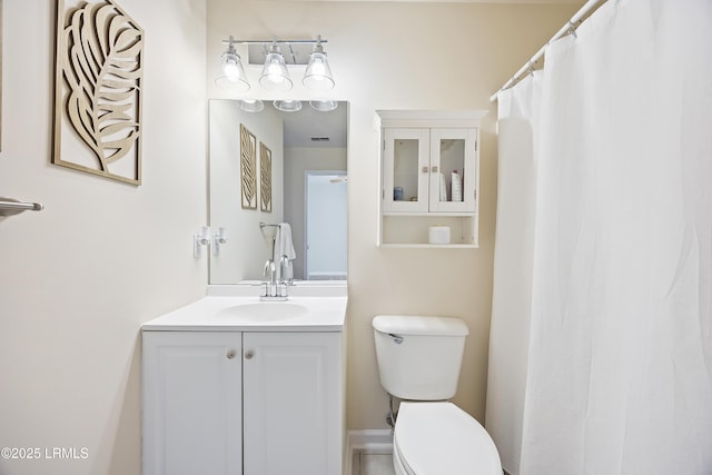 full bath featuring toilet and vanity