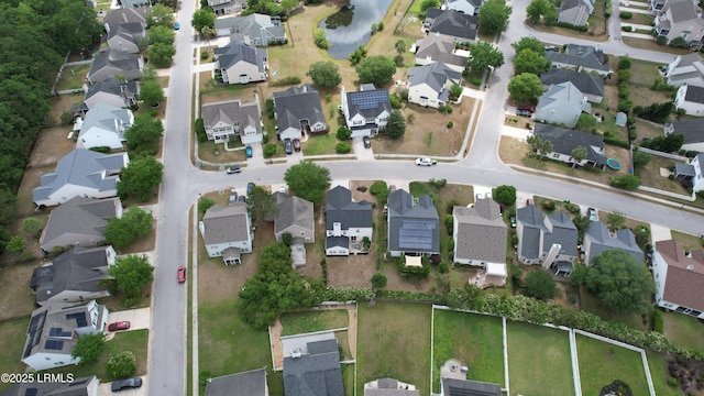 bird's eye view with a residential view and a water view