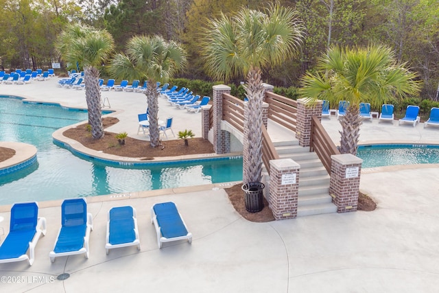pool with a patio area