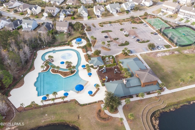 birds eye view of property with a residential view