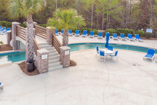 pool with a patio