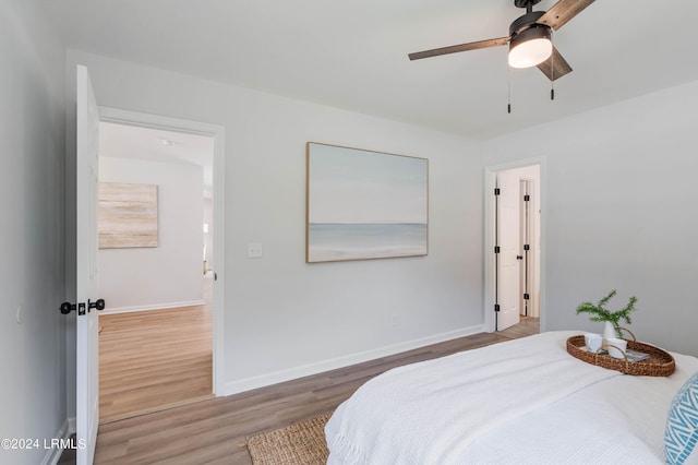 bedroom featuring ceiling fan and wood-type flooring