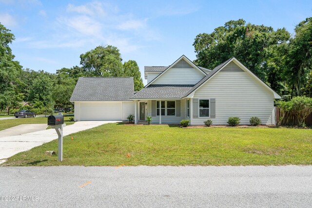 view of front of house with a garage and a front yard