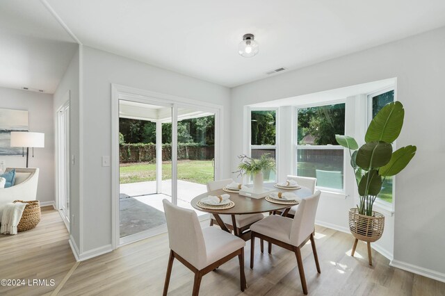 dining room featuring plenty of natural light and light wood-type flooring