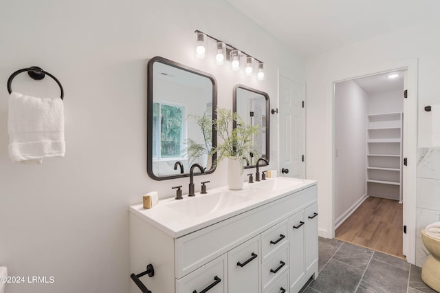 bathroom with vanity and hardwood / wood-style floors