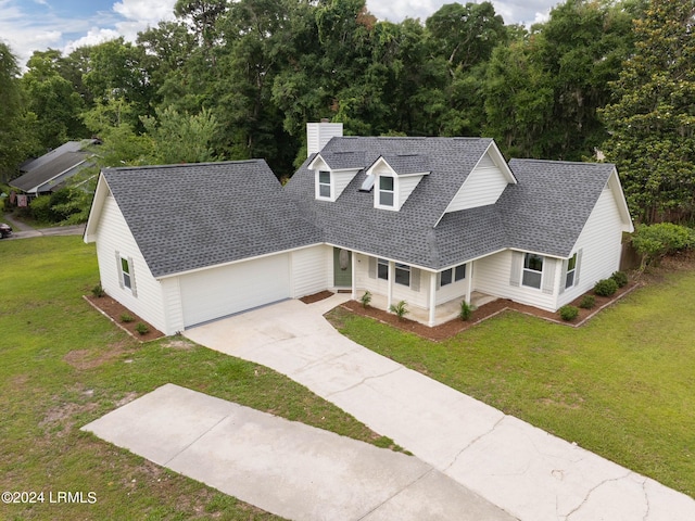 view of front of home featuring a garage and a front yard